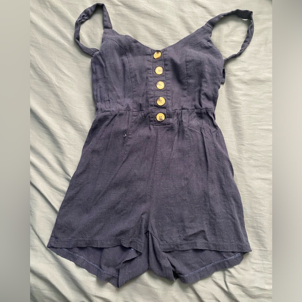 adorable navy/dark blue romper with a bow in the back!